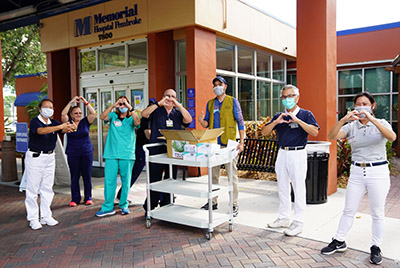 Memorial Hospital staff receiving donated personal protective equipment