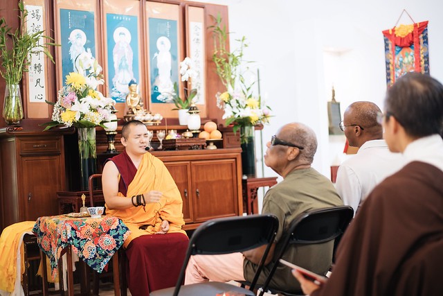 A visiting monk sharing a Dharma talk with guests at a BD Foundation gathering